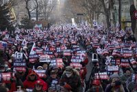 Supporters of South Korean President Yoon Suk Yeol protest near the Constitutional Court of Korea in Seoul, South Korea, on Tuesday, Jan. 21, 2025. Yoon said he was a firm believer in free democracy as he made his first appearance in an impeachment trial on Tuesday looking into his shocking and brief imposition of martial law last month. Photographer: Woohae Cho/Bloomberg